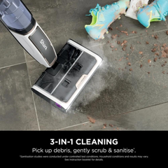 Shark SteamPickUp SD200ME steam cleaning muddy football boots and debris off a tile floor