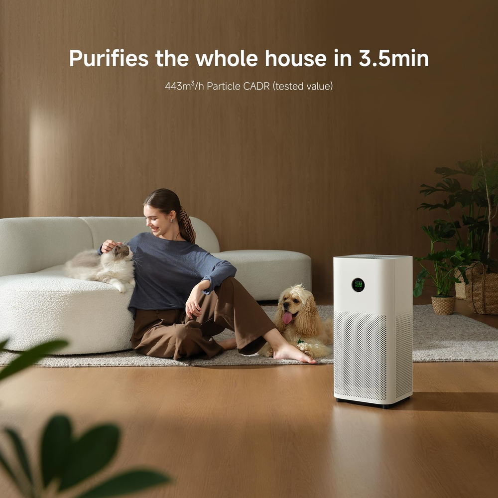 Xiaomi Smart Air Purifier 6 purifying a living room with a woman, cat and dog, 443 cubic metres per hour CADR