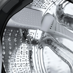 Close-up of the Bosch WaveDrum interior showing the droplet-shaped drum structure