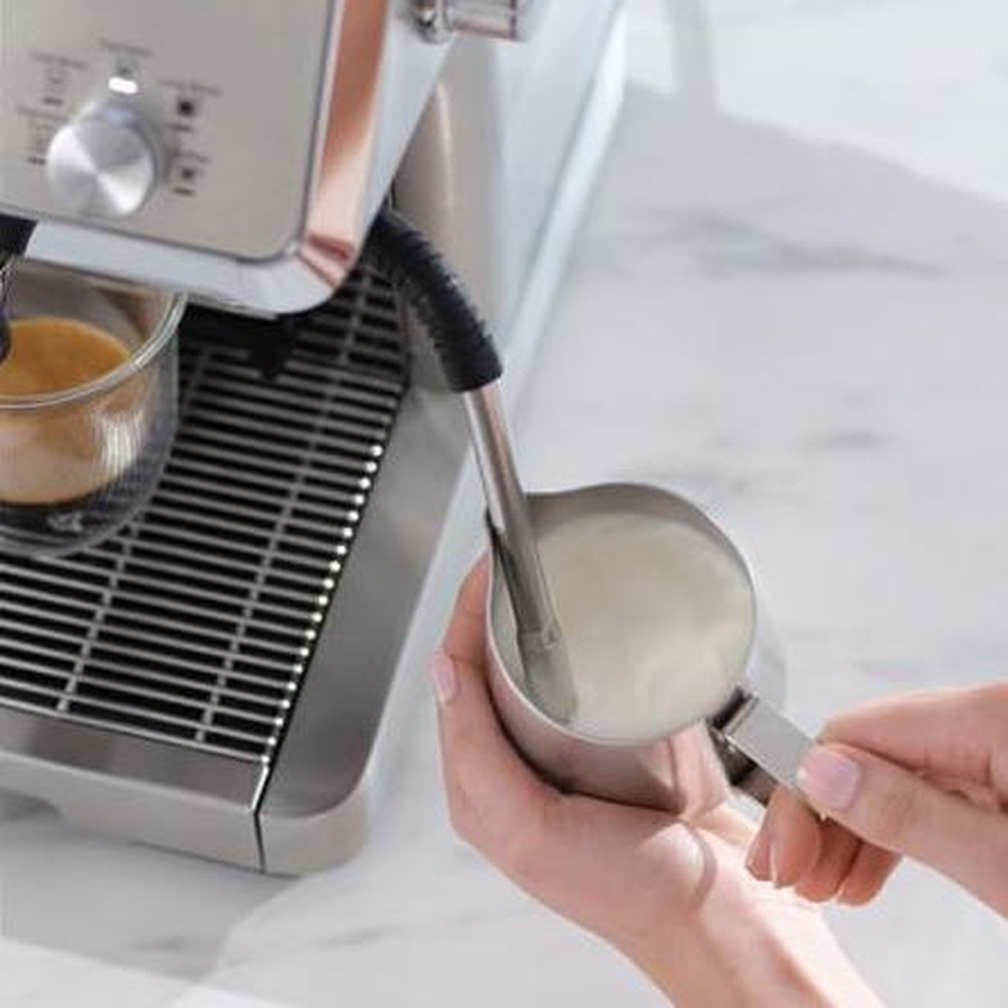 De'Longhi EC9555.M My LatteArt steam wand frothing milk into silky microbubble foam